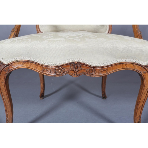 315 - AN 18TH CENTURY FRENCH ELM ELBOW CHAIR, having an encircling moulded frame, carved with leafage, arc... 