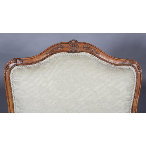 315 - AN 18TH CENTURY FRENCH ELM ELBOW CHAIR, having an encircling moulded frame, carved with leafage, arc... 
