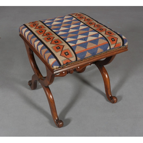 298 - A VICTORIAN MAHOGANY STOOL, on 'X' frame legs joined by a turned stretcher, later cross-stitch cover... 