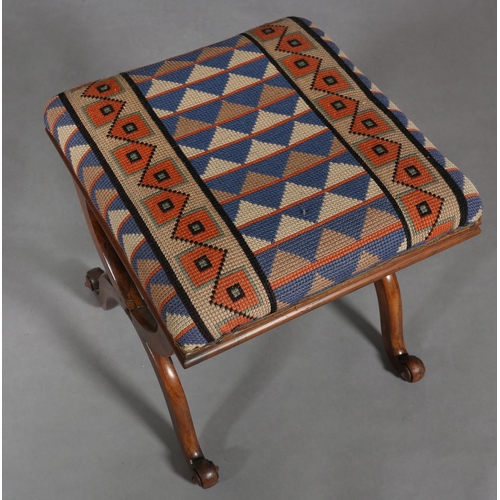 298 - A VICTORIAN MAHOGANY STOOL, on 'X' frame legs joined by a turned stretcher, later cross-stitch cover... 