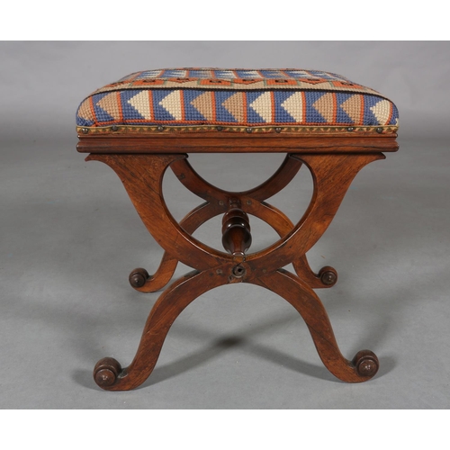 298 - A VICTORIAN MAHOGANY STOOL, on 'X' frame legs joined by a turned stretcher, later cross-stitch cover... 