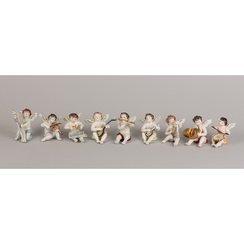 62 - A SET OF NINE VOLKSTEDT PORCELAIN CHERUB MUSICIANS, each playing an instrument (one at fault)