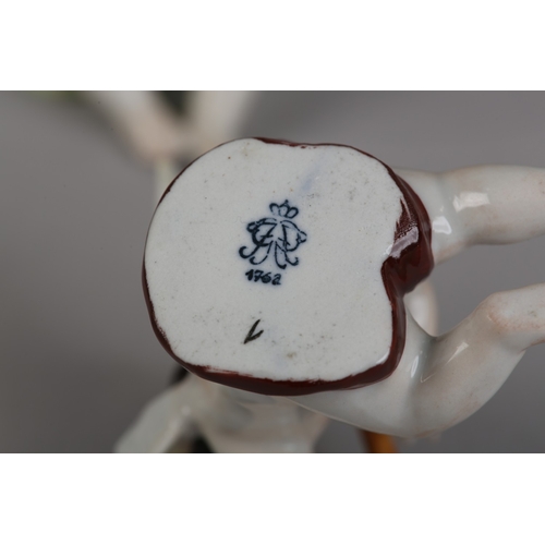 62 - A SET OF NINE VOLKSTEDT PORCELAIN CHERUB MUSICIANS, each playing an instrument (one at fault)