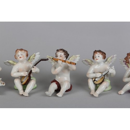 62 - A SET OF NINE VOLKSTEDT PORCELAIN CHERUB MUSICIANS, each playing an instrument (one at fault)