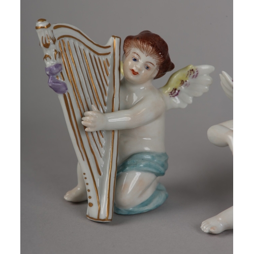62 - A SET OF NINE VOLKSTEDT PORCELAIN CHERUB MUSICIANS, each playing an instrument (one at fault)