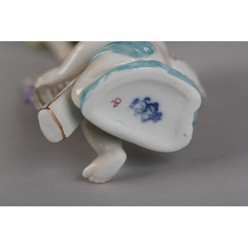 62 - A SET OF NINE VOLKSTEDT PORCELAIN CHERUB MUSICIANS, each playing an instrument (one at fault)