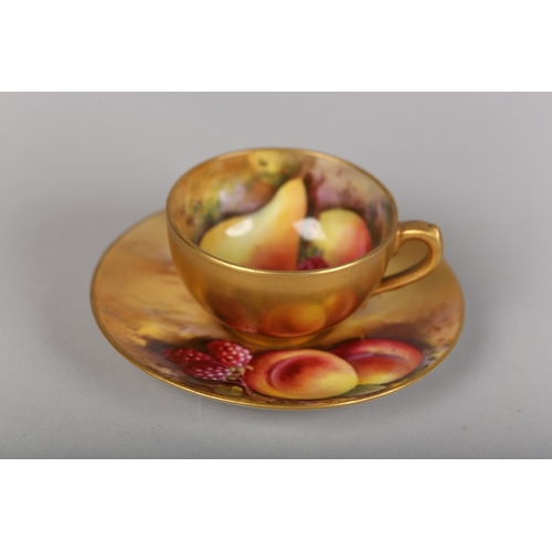 58 - A ROYAL WORCESTER CHINA FRUIT PAINTED CABINET CUP AND SAUCER, signed R Rushton to the cup and J Flax... 