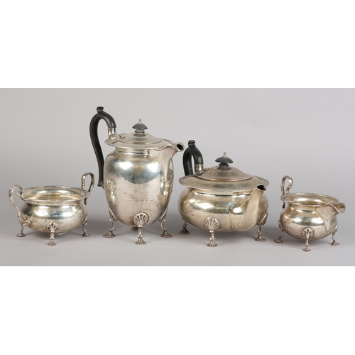 121 - A GEORGE VI FOUR PIECE SILVER TEA SERVICE, Sheffield 1945 for Walker & Hall, compressed circular for... 