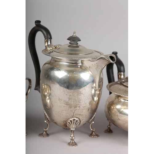 121 - A GEORGE VI FOUR PIECE SILVER TEA SERVICE, Sheffield 1945 for Walker & Hall, compressed circular for... 