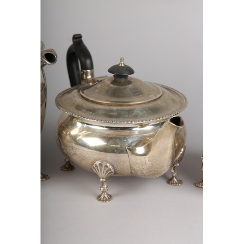 121 - A GEORGE VI FOUR PIECE SILVER TEA SERVICE, Sheffield 1945 for Walker & Hall, compressed circular for... 