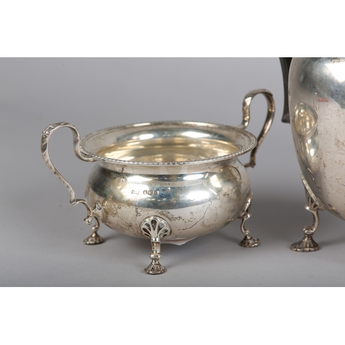 121 - A GEORGE VI FOUR PIECE SILVER TEA SERVICE, Sheffield 1945 for Walker & Hall, compressed circular for... 