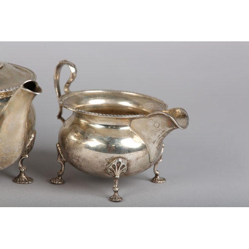 121 - A GEORGE VI FOUR PIECE SILVER TEA SERVICE, Sheffield 1945 for Walker & Hall, compressed circular for... 