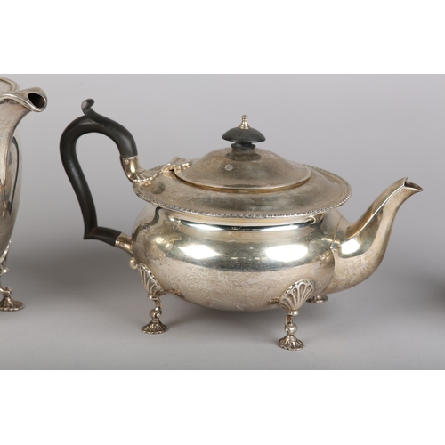 121 - A GEORGE VI FOUR PIECE SILVER TEA SERVICE, Sheffield 1945 for Walker & Hall, compressed circular for... 