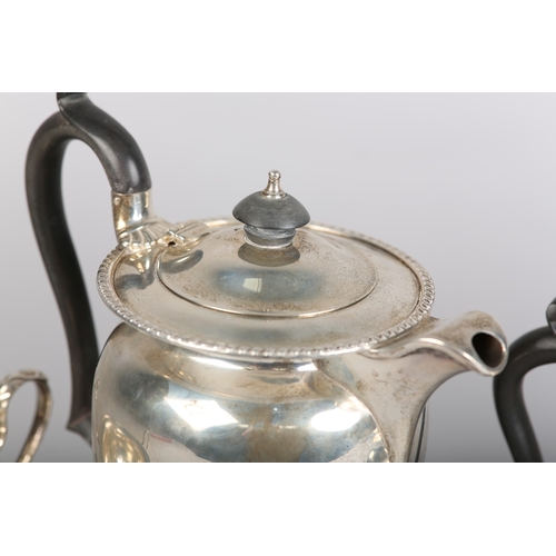 121 - A GEORGE VI FOUR PIECE SILVER TEA SERVICE, Sheffield 1945 for Walker & Hall, compressed circular for... 