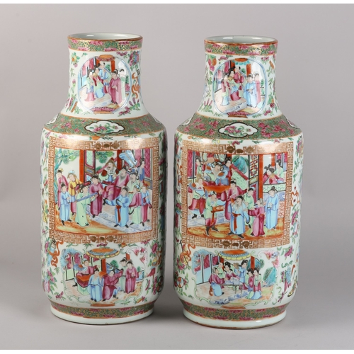 83 - A PAIR OF MID 19TH CENTURY CHINESE FAMILLE ROSE VASES, the shouldered body and ring moulded neck ena... 