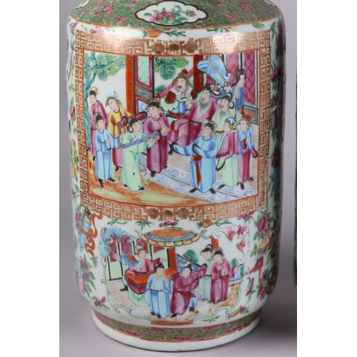 83 - A PAIR OF MID 19TH CENTURY CHINESE FAMILLE ROSE VASES, the shouldered body and ring moulded neck ena... 