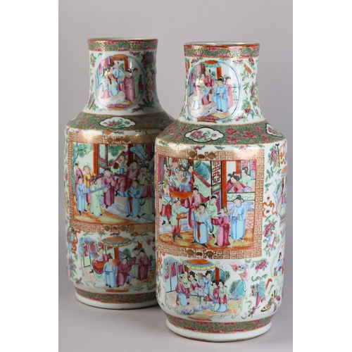 83 - A PAIR OF MID 19TH CENTURY CHINESE FAMILLE ROSE VASES, the shouldered body and ring moulded neck ena... 