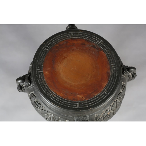 283 - A CHINESE CARVED WOOD URN STAND, circular with pierced foliate apron, on four serpentine legs joined... 