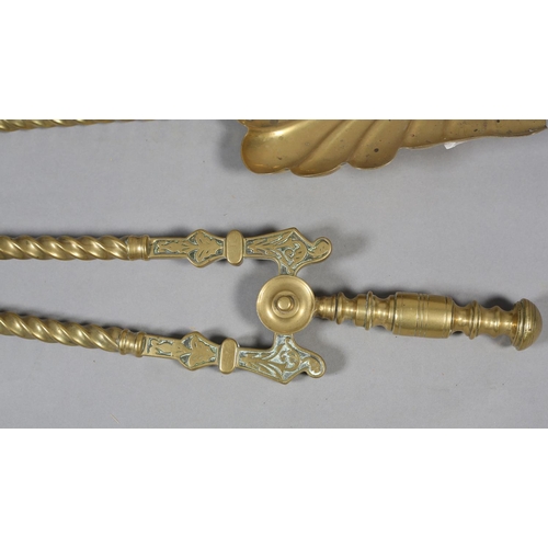 59 - A SET OF THREE VICTORIAN BRASS FIREIRONS with  knopped terminals and writhen handles comprising poke... 