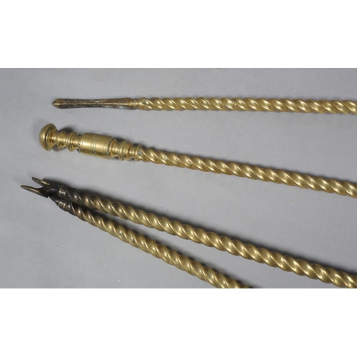 59 - A SET OF THREE VICTORIAN BRASS FIREIRONS with  knopped terminals and writhen handles comprising poke... 