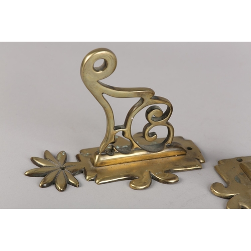 47 - A PAIR OF EARLY 19TH CENTURY BRASS WALL BRACKETS, the back plate with foliate finial, scrolled and p... 