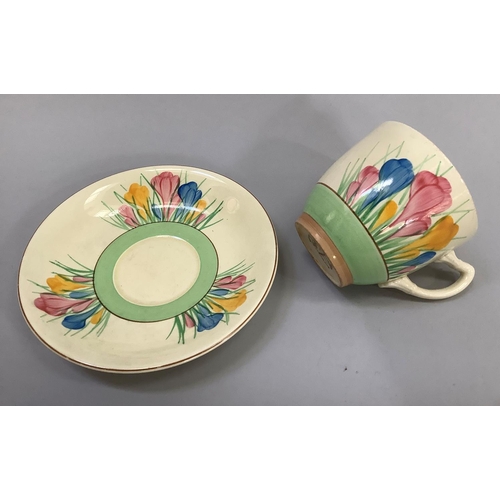 15 - An early Clarice Cliff crocus painted cup and saucer with gilt back-stamp Spring Staffordshire Royal... 