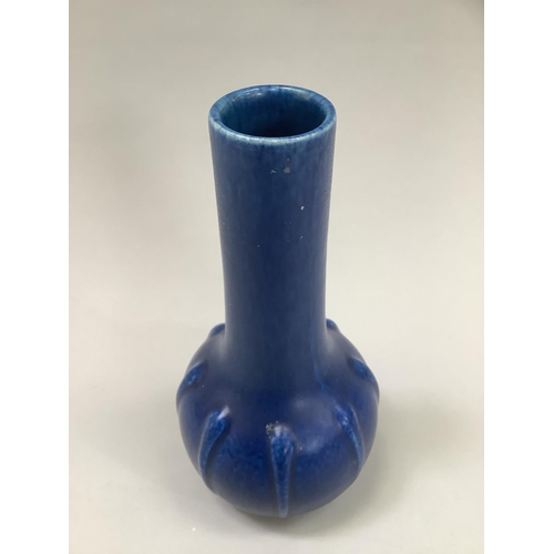 16 - A Royal Lancastrian blue mottle glaze vase having an elongated neck and ribbed circular body, impres... 