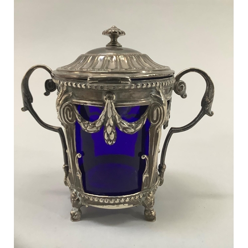 20 - A late 19th century French EPNS mustard pot having a domed cover with finial twin-leaf capped handle... 
