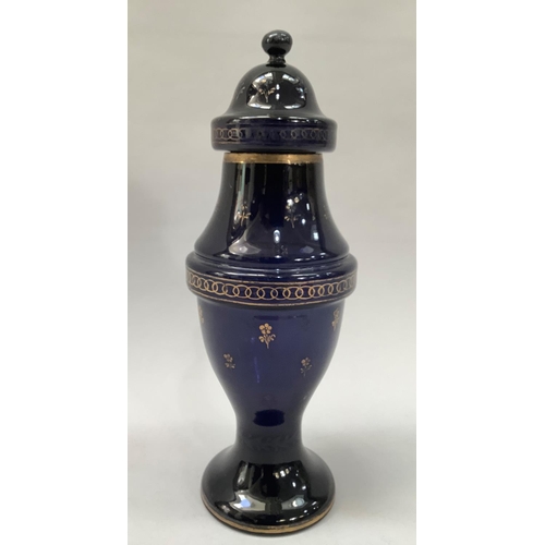 24 - A 19th century blue glass vase and cover printed in gilt with sprigs of flowers, leaf and circlet bo... 