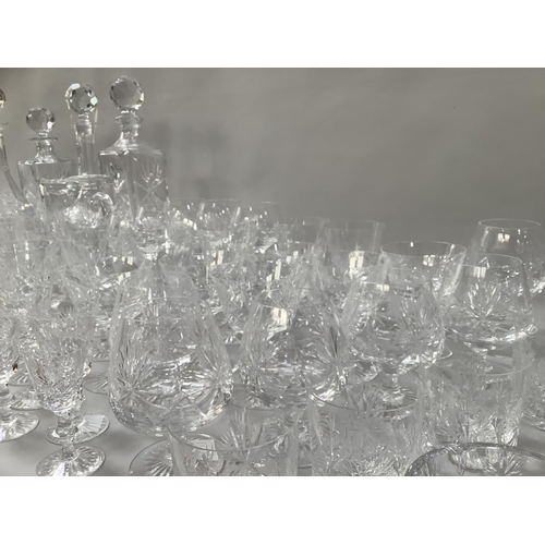 26 - A suite of Edinburgh crystal, star of Edinburgh design, including a set of twelve brandy balloons, t... 