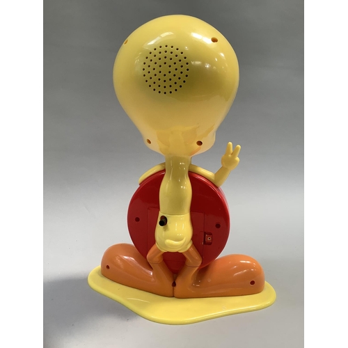 29 - A Tweety Pie alarm clock, the dial saying Looney Tunes, made in coloured plastics, 32cm high