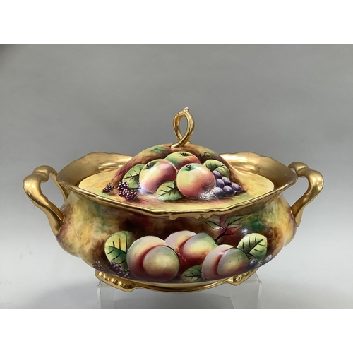 41 - A Sovereigndale fruit painted two handled tureen and domed cover with loop handle painted with apple... 
