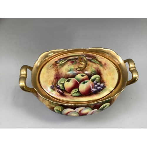 41 - A Sovereigndale fruit painted two handled tureen and domed cover with loop handle painted with apple... 