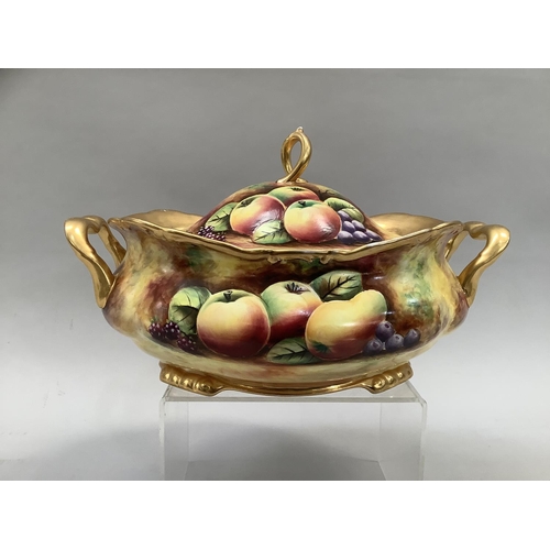 41 - A Sovereigndale fruit painted two handled tureen and domed cover with loop handle painted with apple... 