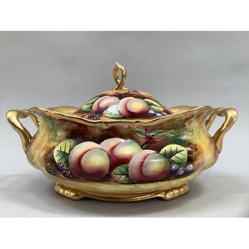 41 - A Sovereigndale fruit painted two handled tureen and domed cover with loop handle painted with apple... 