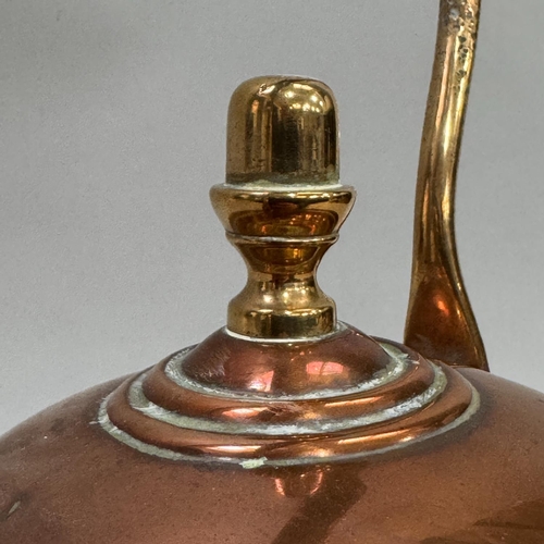 54 - An early 20th century copper kettle, 32.5cm high