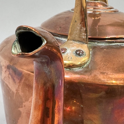 54 - An early 20th century copper kettle, 32.5cm high