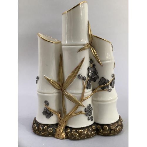 6 - A Royal Worcester triple vase in the form of bamboo sticks overlaid with blossom in white and gilt, ... 