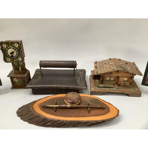 53B - A musical Swiss chalet jewellery box, a longcase clock, a musical toilet roll holder, a musical two-... 