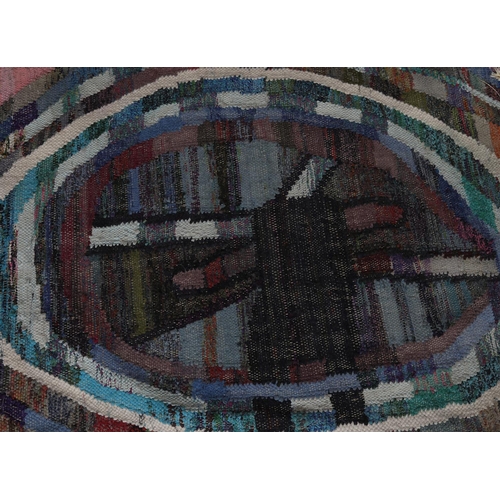 59 - A Moroccan Berber rug in pink, pale green, blue, mauve and charcoal of 'wheel' design, 235cm long x ... 