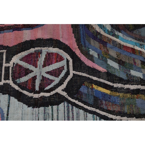 59 - A Moroccan Berber rug in pink, pale green, blue, mauve and charcoal of 'wheel' design, 235cm long x ... 