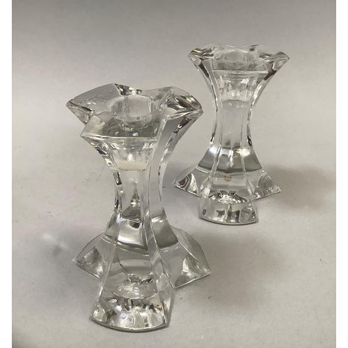 21 - A pair of Josef Reidel crystal candle sticks of triform section etched mark to base, 12cm high