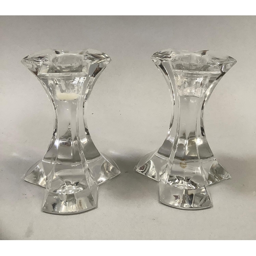 21 - A pair of Josef Reidel crystal candle sticks of triform section etched mark to base, 12cm high