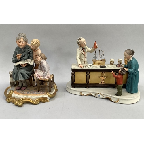 31 - Two Italian ceramic groups in the style of Capodimonte, one a grandmother reading to her grandchildr... 