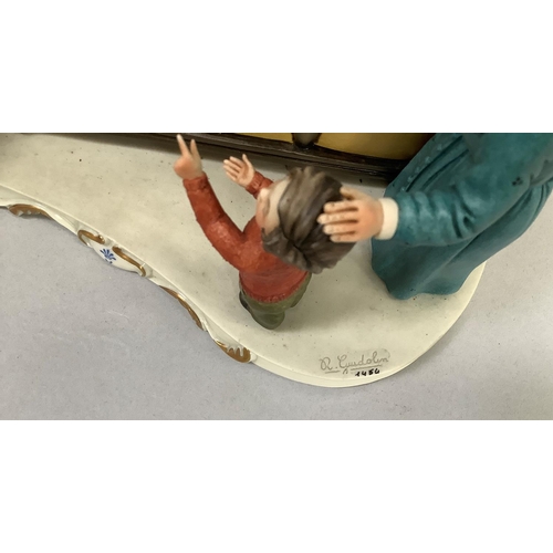 31 - Two Italian ceramic groups in the style of Capodimonte, one a grandmother reading to her grandchildr... 