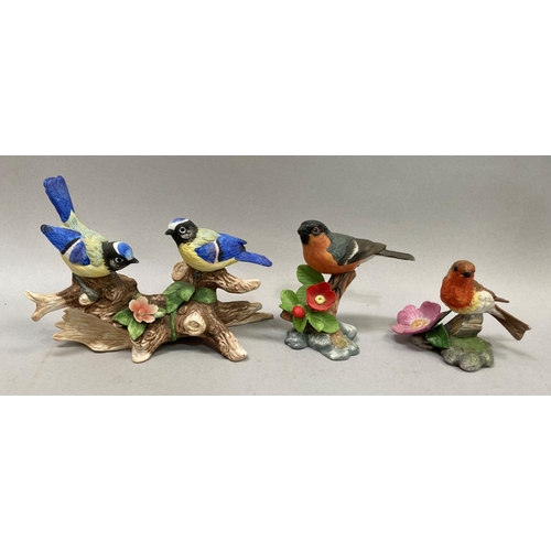 39 - A collection of nine porcelain birds by Franklin Mint