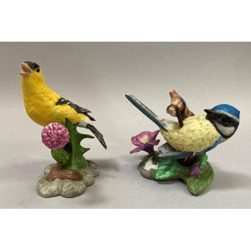 39 - A collection of nine porcelain birds by Franklin Mint