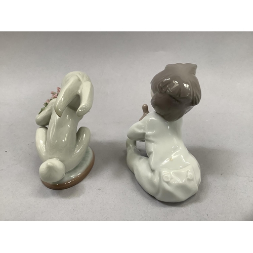 58 - A Lladro figure of a young child dressed in a rabbit costume and holding flowers, 9cm high, together... 