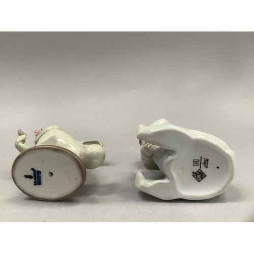 58 - A Lladro figure of a young child dressed in a rabbit costume and holding flowers, 9cm high, together... 