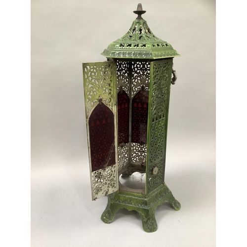 20 - An early 20th century green enamelled cast iron lantern casing of hexagonal outline, pierced in flor... 